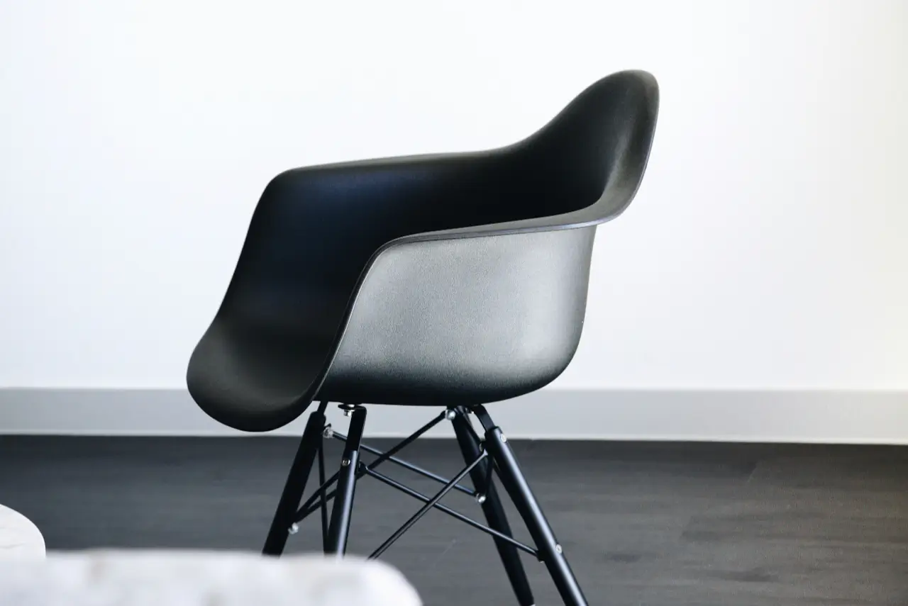 Modern black chair in a minimal room