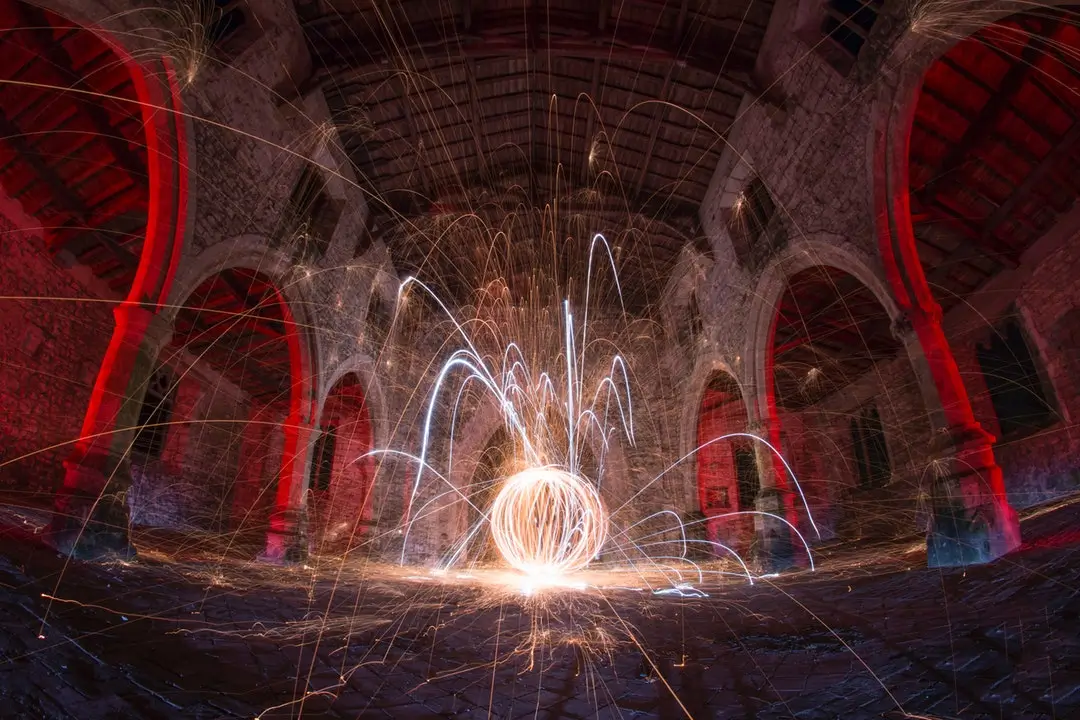 Glowing sphere of sparks in an old stone hall